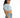 Model in the light blue Jaylah cropped button-down shirt with front pockets and streetwear denim shorts.