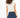 Back view of the white sleeveless Verona Essential Tee featuring a pleated waist, paired with slim fit blue Carbon Jeans.