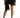 Harlow black satin mini skirt with fringe hem and wrap detail on model, paired with high heels.
