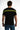 Back view of the Trace Graphic Tee in Carbon black, featuring neon yellow urban text and stripes across the shoulders.