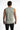 Back view of a man in the Carbon Game Over Graphic Tank, a light grey sleeveless streetwear top in a relaxed fit.