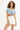 Model wearing a light blue Nova String Crop Top with adjustable drawstring front and high-waisted white denim shorts.