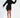 A model poses in a black hooded dress with a unique asymmetrical hem and stylish ankle boots.