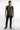 Model in Mason slim straight black jeans with subtle distressing, olive t-shirt, and black sneakers on white backdrop.