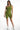 Model wearing olive green Karina one-shoulder crop tank and matching biker shorts, streetwear aesthetic for women.