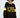 Model in black ALPES oversized long sleeve ribbed knit top with yellow block lettering and athletic sleeve stripes.